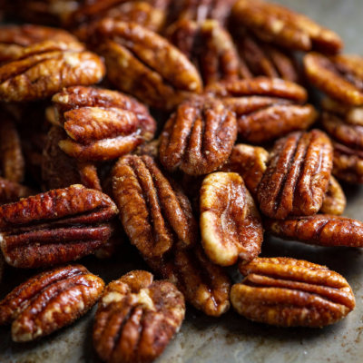 Roasted pecans in a bowl.