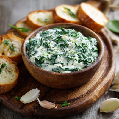 A creamy spinach dip in a bowl